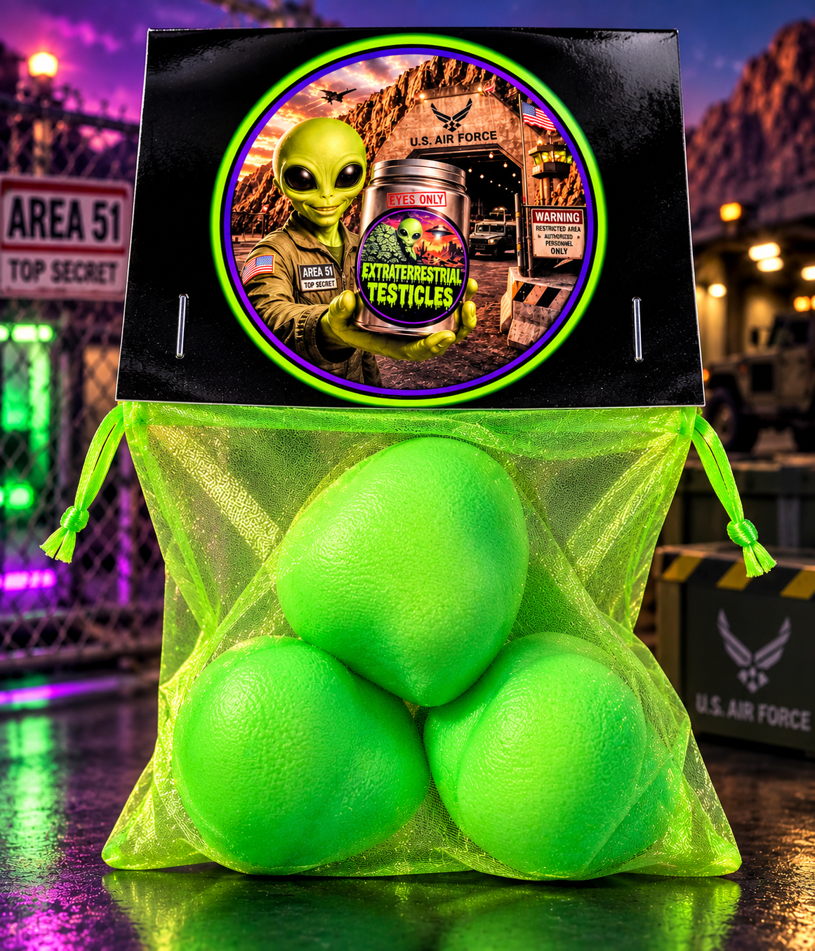 Three green squishies in a mesh sack with Extraterrestrial Testicles alien packaging
